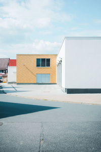 Exterior of building by street against sky