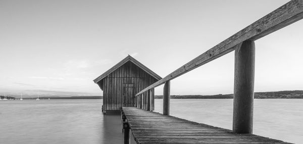 Pier over sea against sky