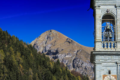 Low angle view of temple against clear blue sky