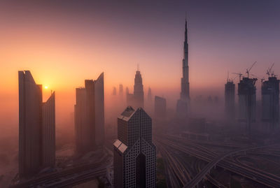 Aerial view of city at sunset