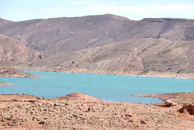 Scenic view of desert against blue sky