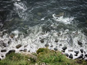 High angle view of rocks at coastline