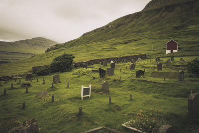 Scenic view of cemetery against sky in faroe islands