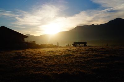 Scenic view of field against sky during sunset