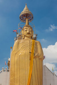 Low angle view of statue of temple against sky