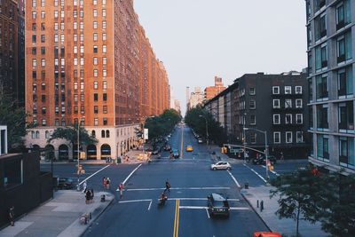 Road amidst building in city