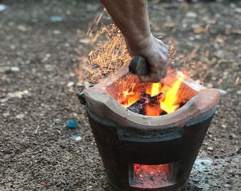 Blacksmith forging metal in burning coal