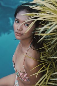 Portrait of young woman swimming in pool