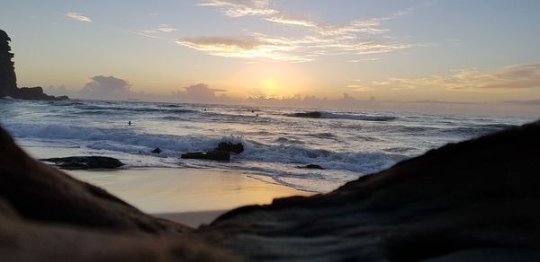 Scenic view of sea against sky during sunset