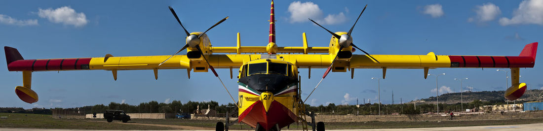 Firefighting propeller aircraft on apron at luqa airfield in malta