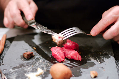 Close-up of man preparing food