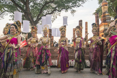 Group of people against trees