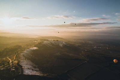 Aerial view of landscape against sky during sunset