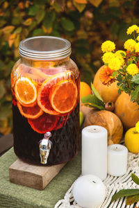 Close-up of drink on table in beautiful jar in autumn garden