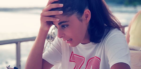 Portrait of young woman looking away