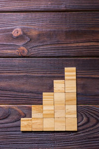 High angle view of wooden plank on table