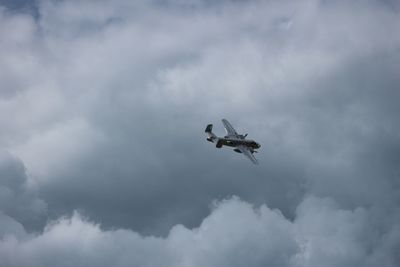 Low angle view of airplane flying in sky