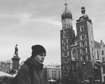 Portrait of man against buildings in city