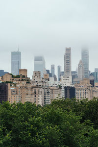 Buildings in city against sky
