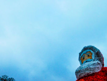 Low angle view of statue against clear blue sky