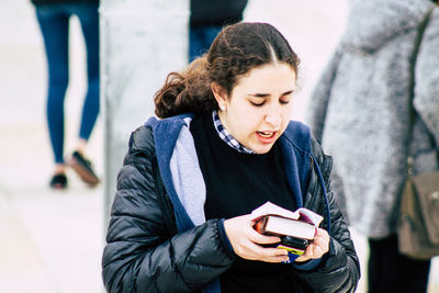 Young woman using mobile phone