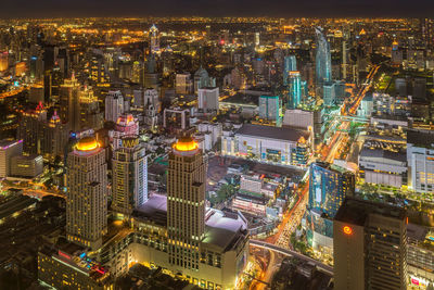 High angle view of illuminated city buildings at night