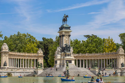 Statue in front of historical building