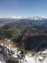 Aerial view of landscape against clear sky during winter