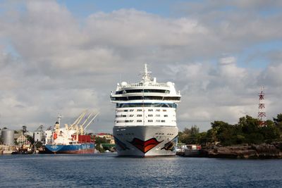 Ship sailing on sea against sky