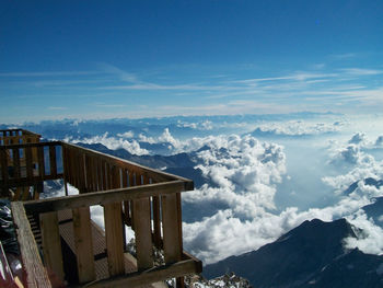 Scenic view of building and mountains against sky