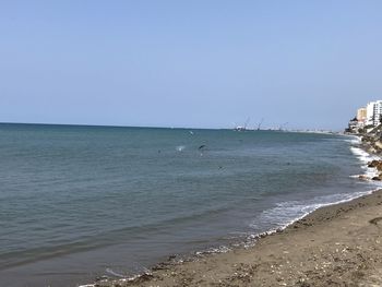 Scenic view of sea against clear sky