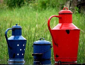 Traditional metal vessels in blue and red