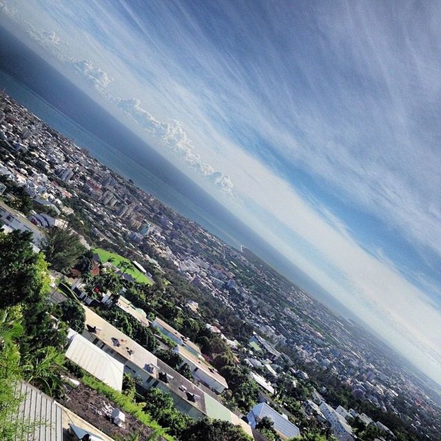 sea, high angle view, building exterior, built structure, architecture, water, horizon over water, sky, scenics, tree, aerial view, crowded, city, cityscape, nature, beauty in nature, beach, residential district, coastline, landscape