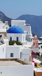 Houses against mountain range