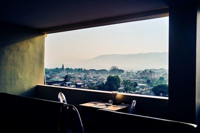 View of residential district seen through window