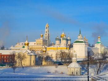 Buildings against sky during winter