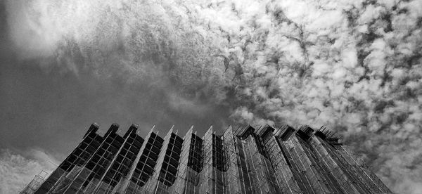 Low angle view of tall building against sky