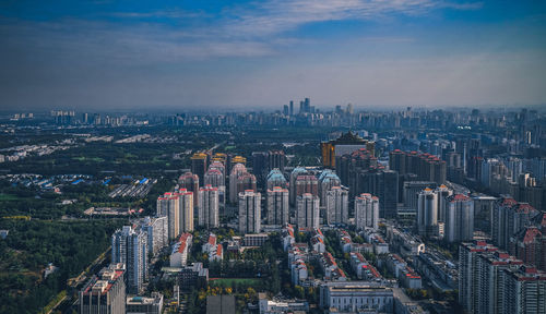 High angle view of illuminated buildings in city against sky