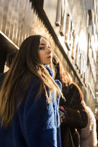 Close-up of young woman in city