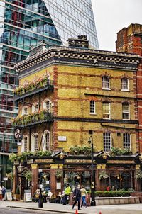 People walking in front of building