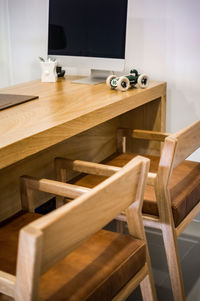 Ophthalmologist's office wooden consulting room with computer on the desk,