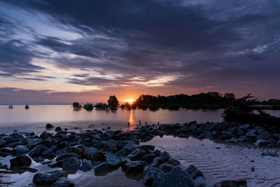 Scenic view of sea against sky during sunset