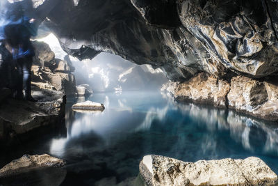 Rock formations over calm lake