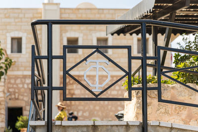 Close-up of metal railing of building