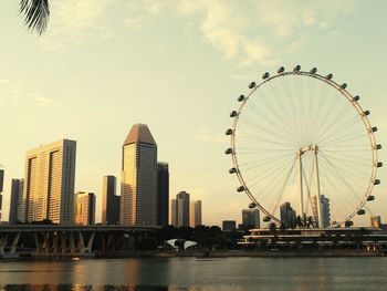 Low angle view of ferris wheel in city