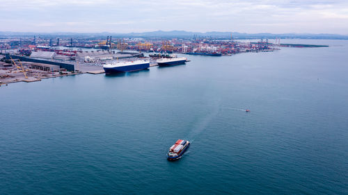 Boats in sea against sky