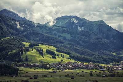 Scenic view of landscape and mountains against sky