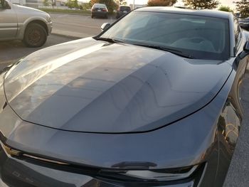 Close-up of car parked on street