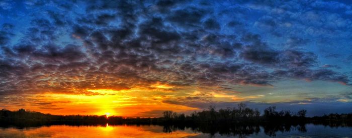 Scenic view of lake at sunset