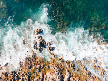 Aerial image of waves and rocks